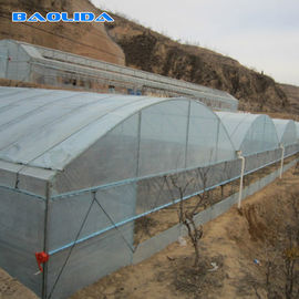 細流かんがいシステム植物の養樹園が付いているMultispanのプラスチック フィルムの温室はテントを育てる